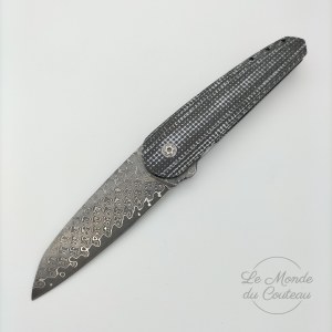 Collectible framelock knife by Alain André scaled
