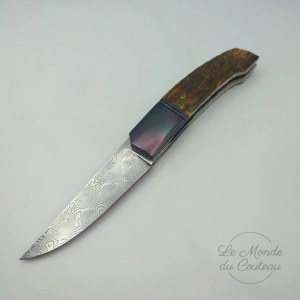 Handcrafted folding knife in mammoth:zirco and Damascus by Giuseppe Pala